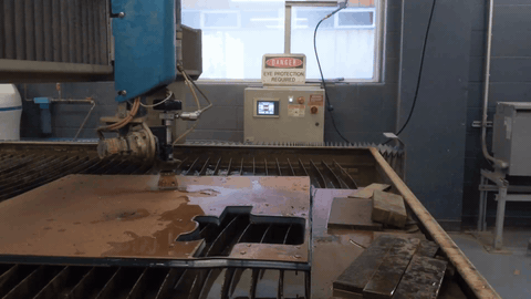 Animated clip of the waterjet cutting sandwich-stacked PETG sheets in one pass