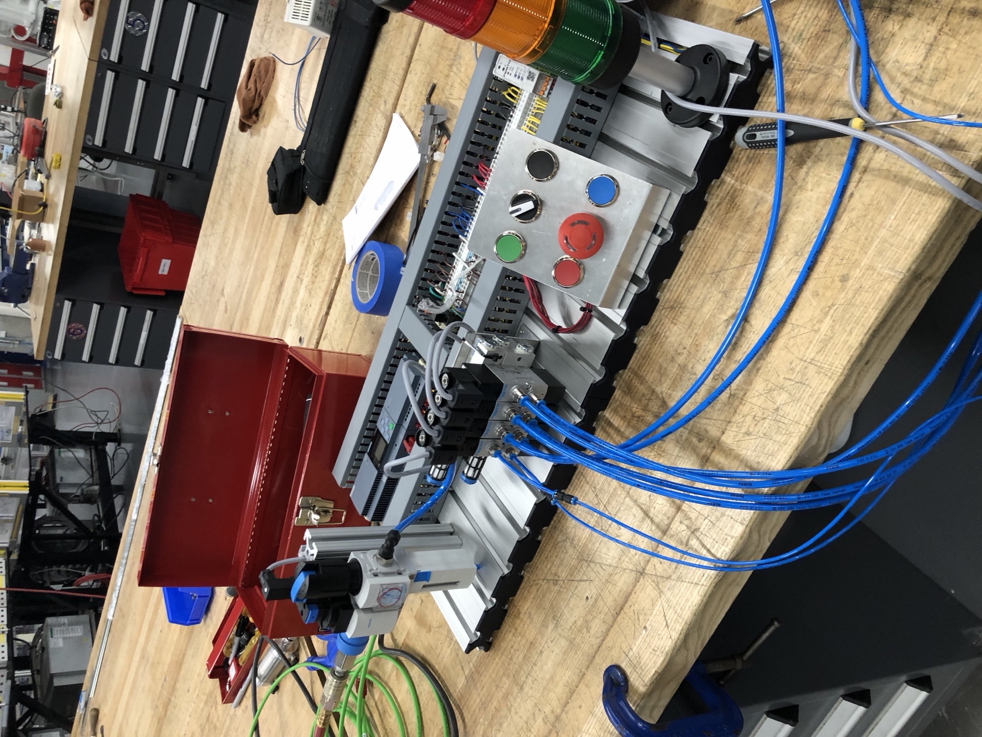 Polymechanics control panel from an alternate angle showing the indicator stack and start/stop array