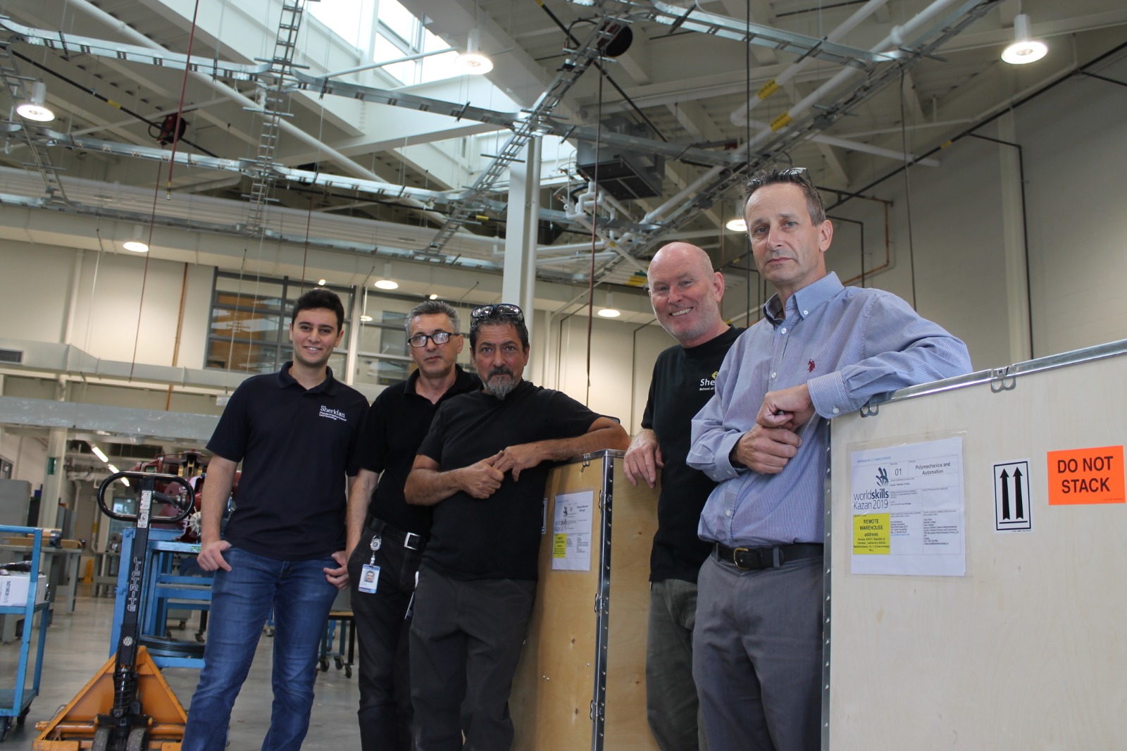 Sheridan CAMDT team standing beside the Industrial Mechanical Millwright shipping crate bound for WorldSkills Kazan 2019